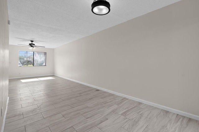 spare room with ceiling fan, a textured ceiling, and light hardwood / wood-style flooring