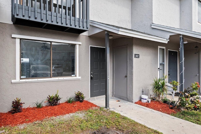 property entrance with a balcony