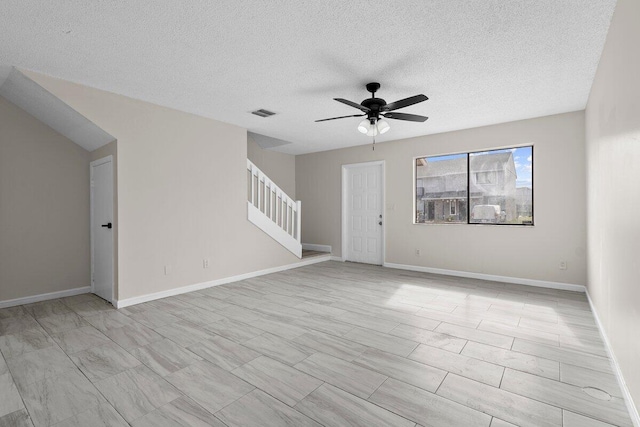 unfurnished room with a textured ceiling and ceiling fan