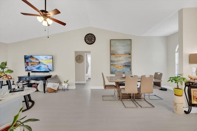 dining area with a healthy amount of sunlight, ceiling fan, and lofted ceiling