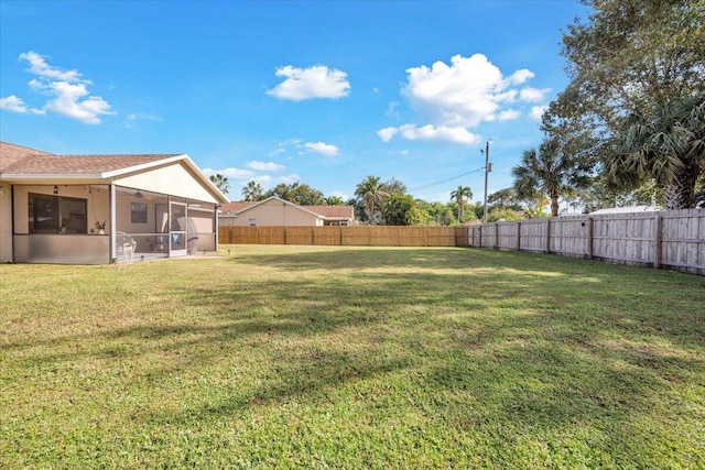 view of yard with a sunroom