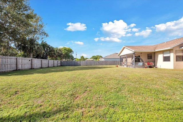 view of yard with a sunroom