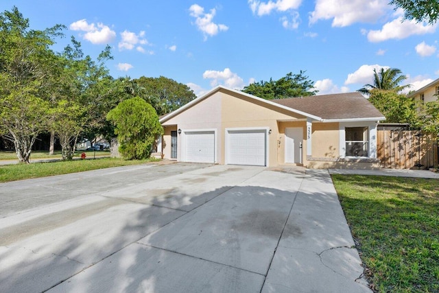 single story home with a garage and a front lawn