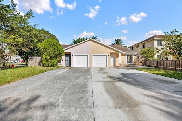 view of front of house featuring a garage and a front yard