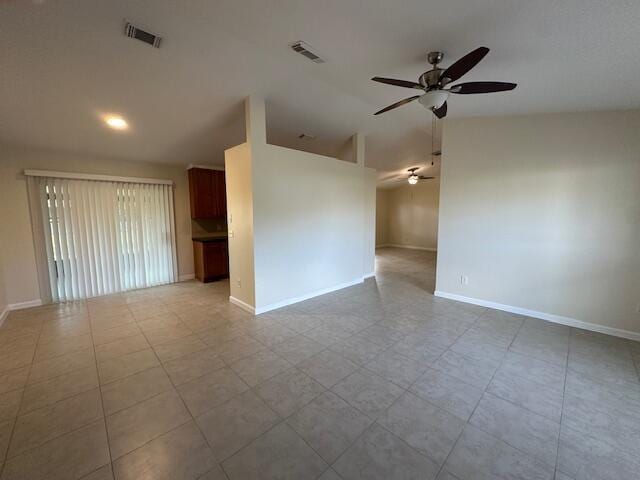 unfurnished room featuring ceiling fan and lofted ceiling