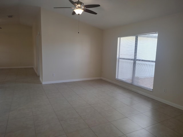 tiled empty room with ceiling fan