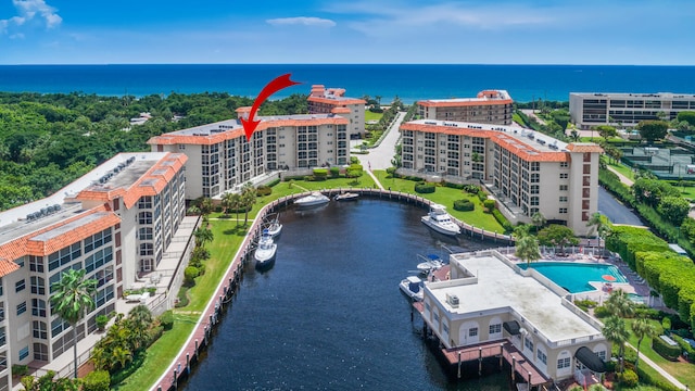 birds eye view of property featuring a water view