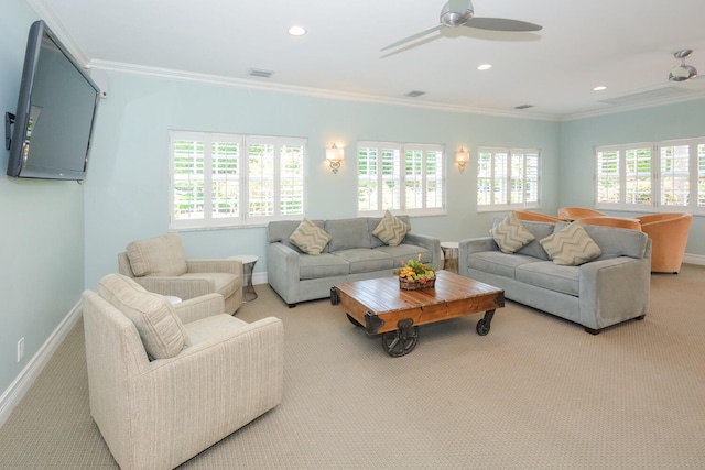 carpeted living room featuring ceiling fan and ornamental molding