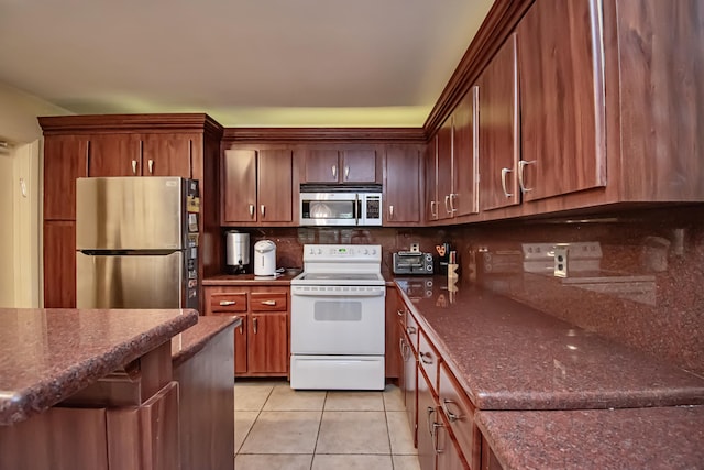 kitchen with light tile patterned floors, backsplash, and stainless steel appliances