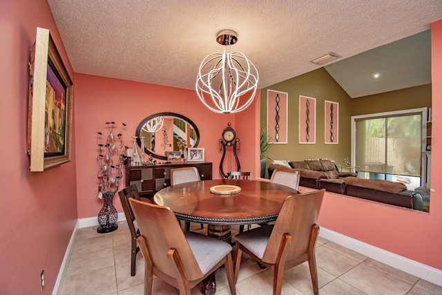 tiled dining area with a chandelier, a textured ceiling, and vaulted ceiling