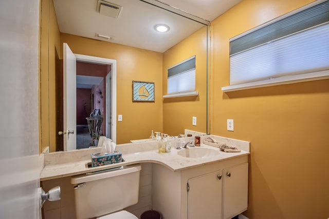 bathroom with vanity and toilet