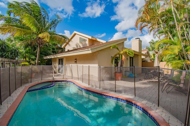 view of swimming pool featuring a patio