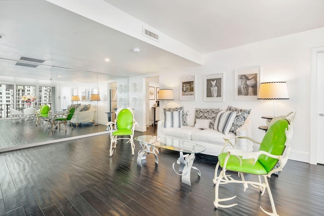 living room with dark hardwood / wood-style flooring