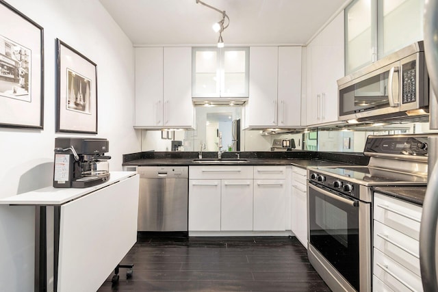 kitchen with sink, white cabinetry, and appliances with stainless steel finishes