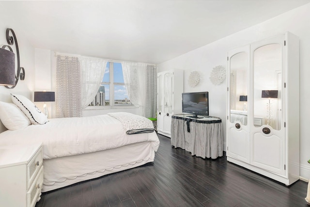 bedroom featuring dark hardwood / wood-style floors