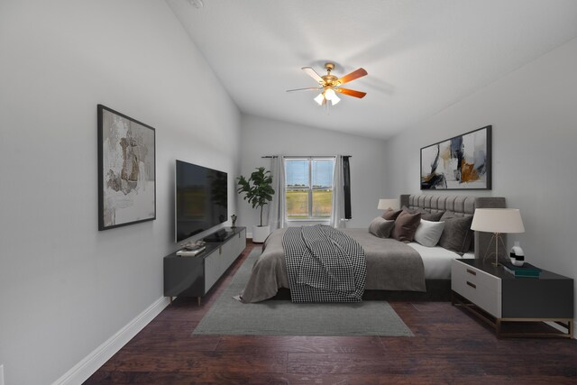 bedroom featuring ceiling fan, dark hardwood / wood-style floors, and lofted ceiling