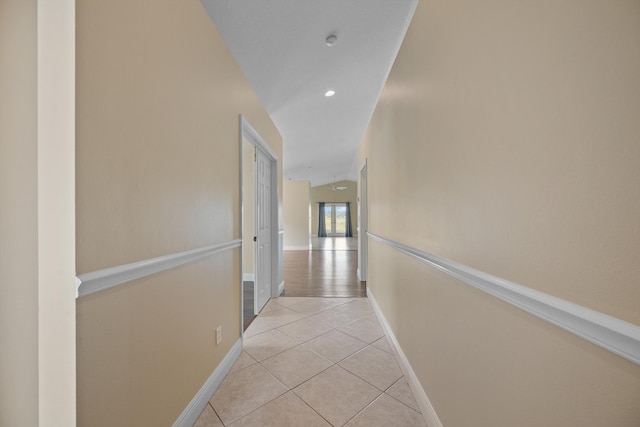 hall featuring light tile patterned flooring