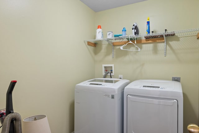 laundry room with independent washer and dryer