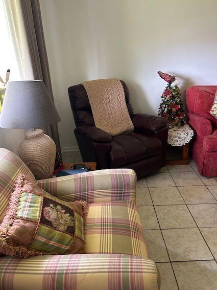 living room featuring light tile patterned floors