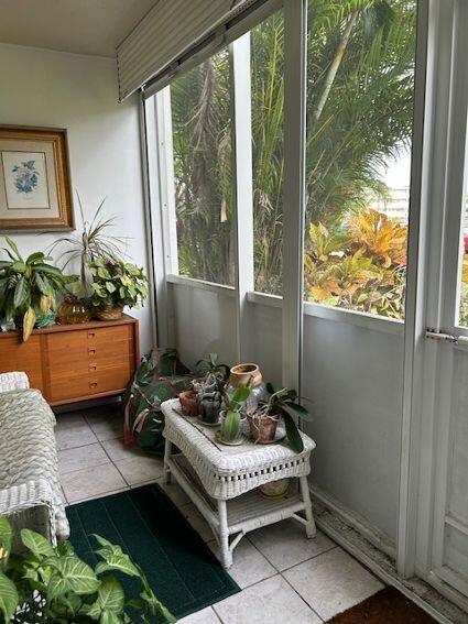 sunroom / solarium featuring a healthy amount of sunlight