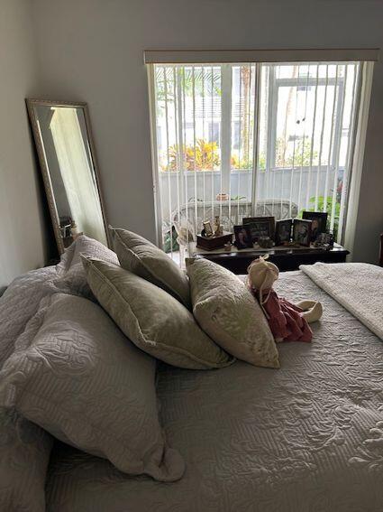 bedroom featuring multiple windows