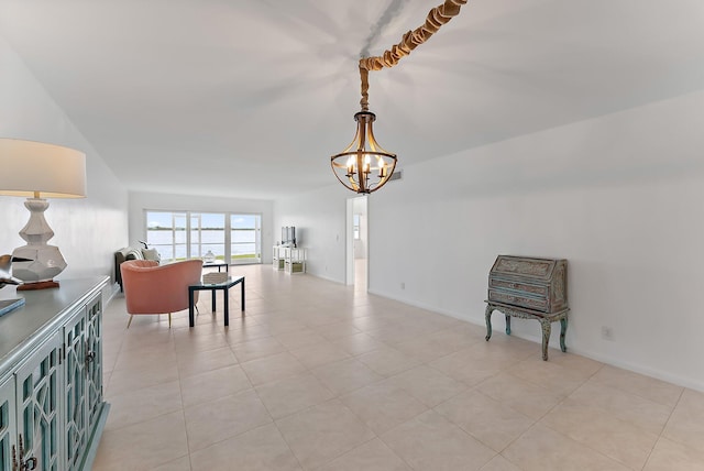 tiled dining space featuring a chandelier