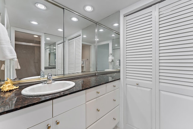 bathroom with vanity and an enclosed shower