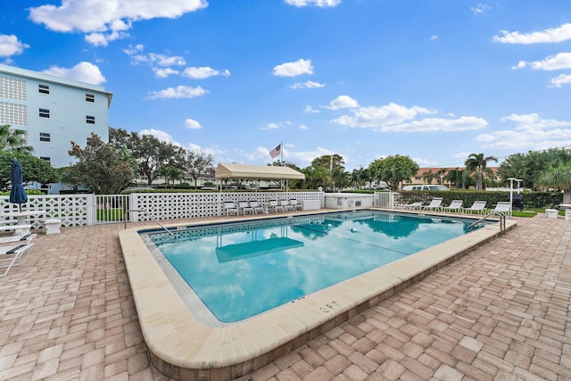 view of swimming pool with a patio