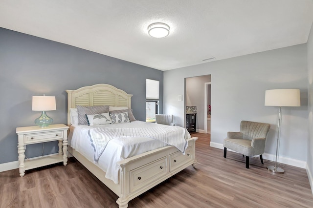 bedroom with wood-type flooring