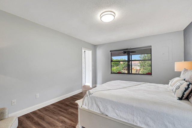 bedroom featuring dark hardwood / wood-style flooring