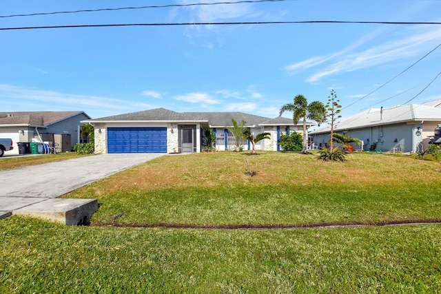 ranch-style home featuring a front yard and a garage