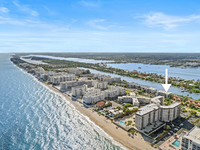 bird's eye view with a water view and a beach view