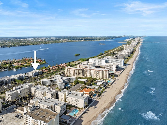 drone / aerial view with a water view and a view of the beach