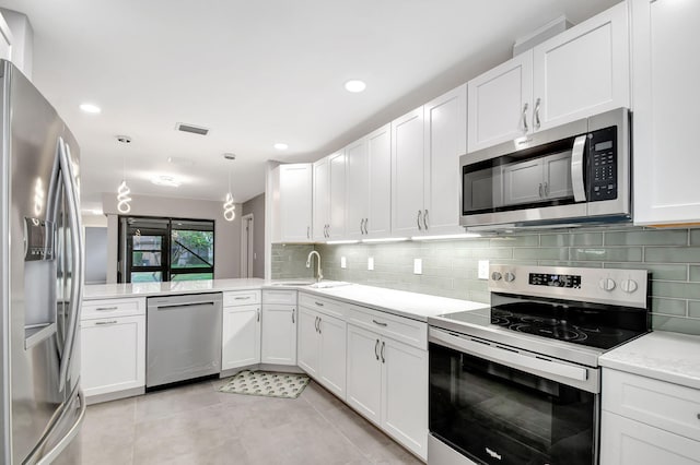 kitchen featuring white cabinets and appliances with stainless steel finishes