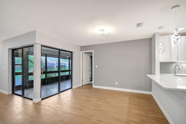 interior space featuring light hardwood / wood-style flooring and sink