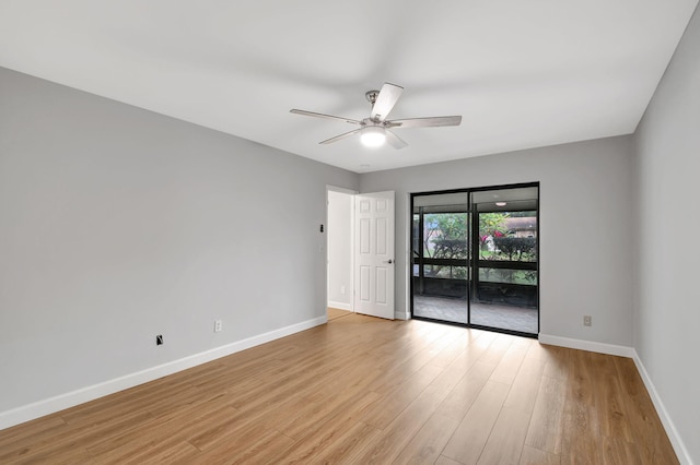 empty room featuring ceiling fan and light hardwood / wood-style floors