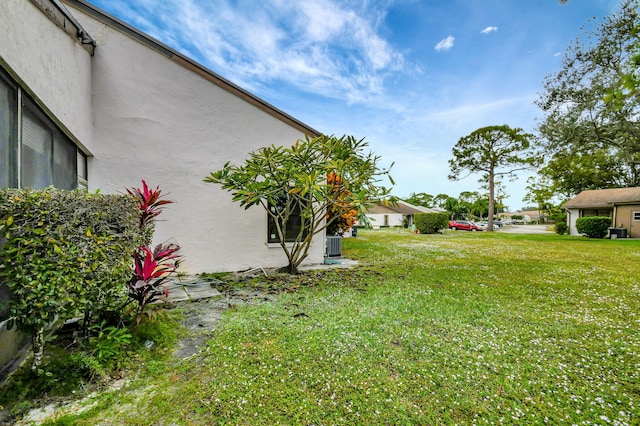 view of yard featuring central AC