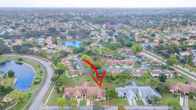 birds eye view of property featuring a water view