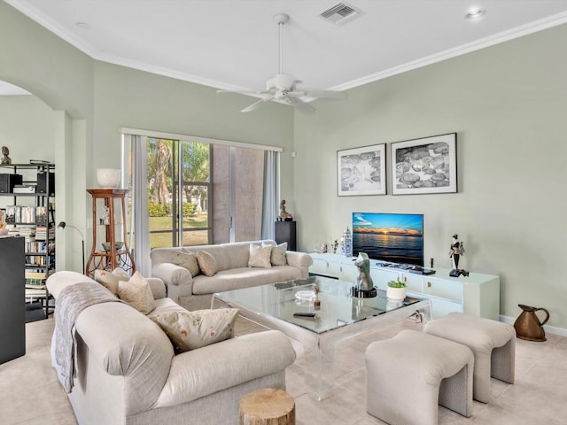 living room with ceiling fan, light tile patterned floors, and ornamental molding