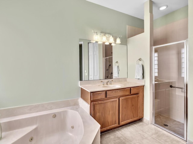 bathroom with tile patterned floors, vanity, and shower with separate bathtub