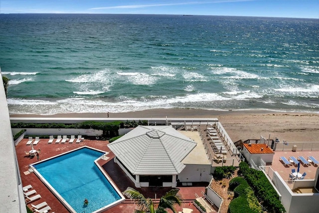 aerial view featuring a water view and a view of the beach