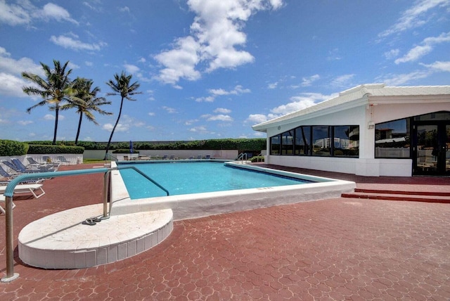 view of swimming pool with a patio