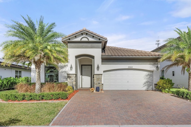 mediterranean / spanish-style home with a garage