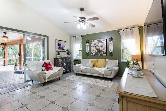 living room featuring ceiling fan and lofted ceiling