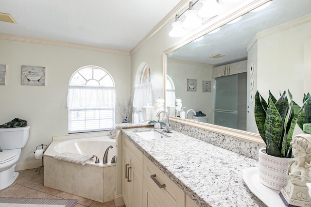 bathroom with vanity, crown molding, tile patterned flooring, toilet, and a tub