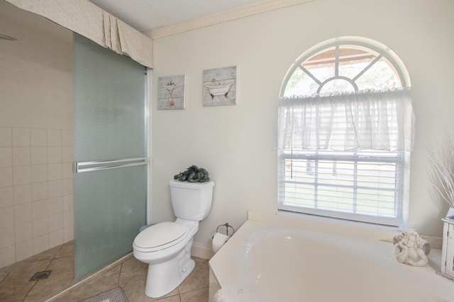 bathroom with toilet, tile patterned flooring, a textured ceiling, and shower with separate bathtub