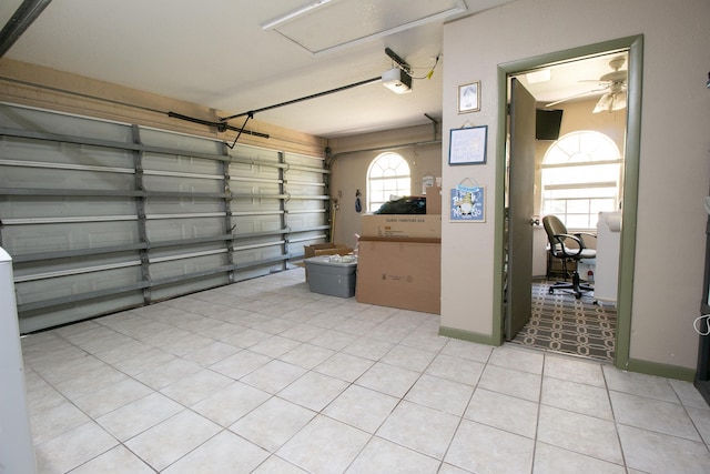 garage featuring a garage door opener and ceiling fan