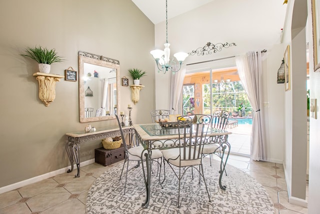 dining area featuring a notable chandelier, light tile patterned flooring, and high vaulted ceiling