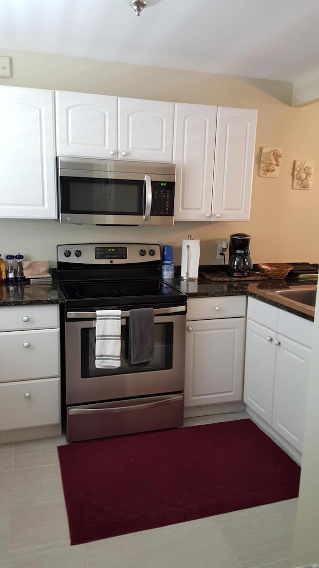 kitchen with white cabinetry, sink, and appliances with stainless steel finishes