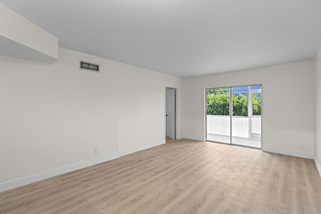 spare room with light hardwood / wood-style flooring